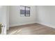 Minimalist bedroom featuring a window, natural light, and hardwood floors at 8503 S 9Th Dr # 17, Phoenix, AZ 85041