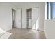 A bedroom featuring closet space with shelves, drawers, and wood flooring at 8503 S 9Th Dr # 17, Phoenix, AZ 85041