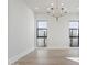 Dining room filled with natural light from large windows and stylish chandelier at 8503 S 9Th Dr # 17, Phoenix, AZ 85041