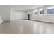 Spacious garage with sealed concrete flooring, windows, equipment, and plenty of room for storage and/or parking at 8503 S 9Th Dr # 17, Phoenix, AZ 85041