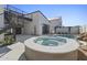 Backyard hot tub and pool area featuring unique landscaping and modern home architecture with second story deck at 8503 S 9Th Dr # 17, Phoenix, AZ 85041