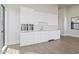 Bright kitchen featuring white cabinetry, stainless steel appliances, and hardwood floors at 8503 S 9Th Dr # 17, Phoenix, AZ 85041