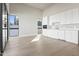 Bright, minimalist kitchen featuring recessed lights, white cabinets, stainless appliances, and outdoor view at 8503 S 9Th Dr # 17, Phoenix, AZ 85041
