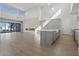 Spacious living room with natural light, fireplace, and modern kitchen area, creating an inviting ambiance at 8503 S 9Th Dr # 17, Phoenix, AZ 85041