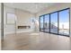 Bright living room with contemporary fireplace, recessed lights, and a large sliding glass door to the outdoor pool at 8503 S 9Th Dr # 17, Phoenix, AZ 85041