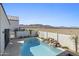 Pool featuring unique rock waterfall feature with views of the desert landscape and mountains beyond the perimeter wall at 8503 S 9Th Dr # 17, Phoenix, AZ 85041