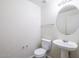 Powder room featuring pedestal sink and toilet at 8723 E Kiowa Ave, Mesa, AZ 85209