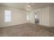 Spacious bedroom with carpet floors and natural light at 8723 E Kiowa Ave, Mesa, AZ 85209