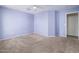 A spacious carpeted bedroom with a ceiling fan at 8723 E Kiowa Ave, Mesa, AZ 85209