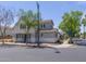 Exterior view of a two-story home with neutral paint, a charming porch, and professional landscaping at 8723 E Kiowa Ave, Mesa, AZ 85209