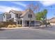 Charming two-story home featuring desert landscaping and neutral colors, creating an inviting curb appeal at 8723 E Kiowa Ave, Mesa, AZ 85209