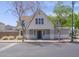 Charming two-story home with neutral paint and a well-manicured front yard provides attractive curb appeal at 8723 E Kiowa Ave, Mesa, AZ 85209
