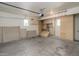 An empty garage with built-in storage cabinets at 8723 E Kiowa Ave, Mesa, AZ 85209