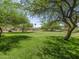 Expansive green space with mature trees creates a serene setting, perfect for outdoor enjoyment at 8723 E Kiowa Ave, Mesa, AZ 85209