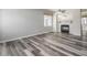 Bright living room with hardwood floors and fireplace at 8723 E Kiowa Ave, Mesa, AZ 85209