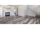 Spacious living room featuring hardwood floors, a fireplace, and staircase at 8723 E Kiowa Ave, Mesa, AZ 85209