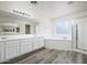 Large bathroom features double sink vanity, soaking tub, and separate shower at 8723 E Kiowa Ave, Mesa, AZ 85209