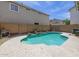 Backyard pool with waterfall feature and privacy fence, perfect for relaxing and entertaining outdoors at 8723 E Kiowa Ave, Mesa, AZ 85209