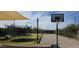Spacious backyard featuring a trampoline, a basketball hoop, and a swing set at 8902 E Baltimore St, Mesa, AZ 85207