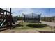 Recreational backyard featuring a trampoline and playground area for outdoor fun at 8902 E Baltimore St, Mesa, AZ 85207