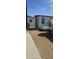Wide backyard features a shed, a chicken coop, and rock landscaping at 8902 E Baltimore St, Mesa, AZ 85207
