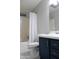 Well-lit bathroom features a shower and vanity with stylish patterned flooring at 8902 E Baltimore St, Mesa, AZ 85207
