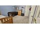 Comfortable bedroom with carpet, a dark wood bedframe and blue-painted walls at 8902 E Baltimore St, Mesa, AZ 85207
