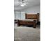 Bedroom with a large wooden bed, carpet and ample natural light at 8902 E Baltimore St, Mesa, AZ 85207