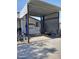 Covered carport space includes a vehicle lift and plenty of room for storage at 8902 E Baltimore St, Mesa, AZ 85207
