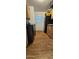 The kitchen is equipped with modern black appliances and wood-look flooring at 8902 E Baltimore St, Mesa, AZ 85207