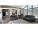Spacious living room with large windows and carpet flooring at 8902 E Baltimore St, Mesa, AZ 85207