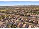 Expansive aerial view showcasing the home's location within a well-maintained community, mountain views in the background at 9632 E Olla Ave, Mesa, AZ 85212