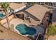 Aerial view showcasing a backyard oasis with a sparkling pool, patio area, and mature trees offering privacy at 9632 E Olla Ave, Mesa, AZ 85212
