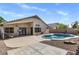 Backyard showing a pool, patio, and gravel landscaping at 9632 E Olla Ave, Mesa, AZ 85212