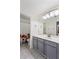 Bathroom featuring gray cabinetry, patterned tile floors and a shower/tub combo at 9632 E Olla Ave, Mesa, AZ 85212