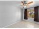 Neutral bedroom featuring a window and tile flooring, complemented by dark curtains at 9632 E Olla Ave, Mesa, AZ 85212