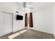 Neutral bedroom with carpet, a ceiling fan, and a television at 9632 E Olla Ave, Mesa, AZ 85212