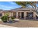 Charming single-story home with a welcoming front porch and desert-style landscaping, creating a warm curb appeal at 9632 E Olla Ave, Mesa, AZ 85212