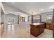 Open-concept kitchen and living space with an island, tiled floors, and a seamless flow for modern living at 9632 E Olla Ave, Mesa, AZ 85212