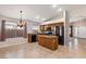 Spacious kitchen features dark appliances and wood cabinets, along with an island creating a functional workspace at 9632 E Olla Ave, Mesa, AZ 85212