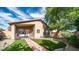 Inviting backyard with artificial turf, paved walkway, and covered patio with stylish seating at 10377 W Yukon Dr, Peoria, AZ 85382