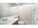 Bathroom with vanity, toilet, and shower curtain at 10377 W Yukon Dr, Peoria, AZ 85382