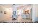 Inviting entry hall featuring tiled floors leading to a kitchen with counter seating at 10377 W Yukon Dr, Peoria, AZ 85382
