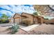 Charming single-story home with a well-maintained front yard, showcasing a neutral color palette at 10377 W Yukon Dr, Peoria, AZ 85382