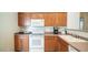 Practical kitchen layout with essential appliances and ample counter space at 10377 W Yukon Dr, Peoria, AZ 85382