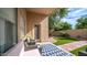 Relaxing covered patio with outdoor seating, view of backyard, and convenient access to the house at 10377 W Yukon Dr, Peoria, AZ 85382