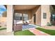 Cozy covered patio featuring comfortable wicker furniture, a patterned rug, and stylish decor at 10377 W Yukon Dr, Peoria, AZ 85382