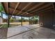 Relaxing covered back patio overlooking the expansive backyard at 105 E Hermosa Dr, Tempe, AZ 85282