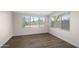 Cozy bedroom with wood-look floors and great natural light from the windows at 105 E Hermosa Dr, Tempe, AZ 85282
