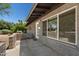 Close up of exterior wall with large windows and concrete pavers at 105 E Hermosa Dr, Tempe, AZ 85282
